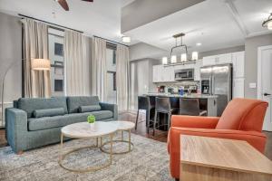 a living room with a couch and a table at Central Downtown Loft | Parking•Gym•Security in Cleveland