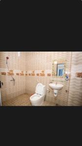 a bathroom with a toilet and a sink at Linda Home in Phường Chày +29 photos