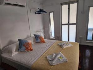 a bedroom with a bed with two towels on it at Twinbeach Sanctuary in Mersing