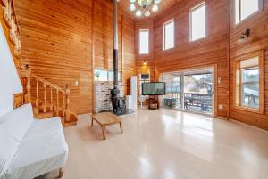 a large room with a bed and a tv in it at Yangpyeong Narinsoom Private Villa in Yangpyeong