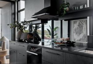 a kitchen with a black counter top and a sink at Eastlake Retreat Kingston in Kingston 