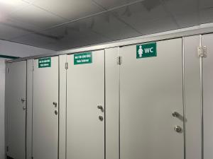 a row of metal lockers with signs on them at Moutain View in Yên Minh