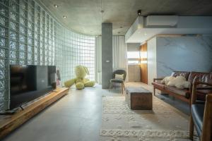 a living room with a large flat screen tv at Sugar House in Wujie +48 photos