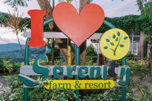 a sign for a garden camp and resort at Serenity Busay Room 1 in Cebu City +1 photo