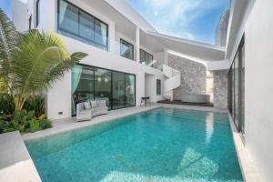 an image of a swimming pool in a house at Mövenpick Pool Villa6BR-NEW2025- in Na Jomtien