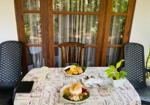 a table with two plates of food on it at Elephant Trail Homestay in Habarana +56 photos