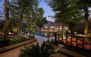 a resort with a swimming pool and a resort at Indochine Sanctuary Hotel in Siem Reap