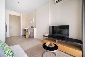 a living room with a large flat screen tv at 2BR Family Condo - Veranda Pattaya - Beachfront in Na Jomtien