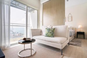 a living room with a couch and a bed at 2BR Family Condo - Veranda Pattaya - Beachfront in Na Jomtien +27 photos