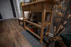 a wooden table with a shelf in a room at BOHO-MOD STUDIO APARTMENTs in Ferris +6 photos
