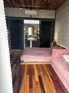 a bedroom with a bed and a couch in it at Hong Ly House in Vĩnh Hy +7 photos