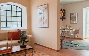 a living room with a couch and a table at 2 Bedroom Nice Apartment In Glemmingebro in Glemminge