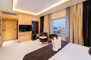 a hotel room with a view of the city at Ratan International in Pondicherry +78 photos
