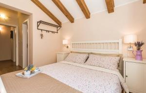 a bedroom with a large white bed in a room at Villa Sirotnjak in Lovran +44 photos