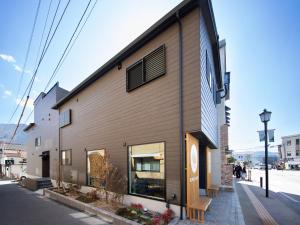 a building on the side of a street at Yufuin Covaco in Yufu