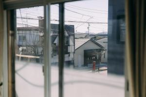 a view from a window of a building at Public Guest House in Karuizawa