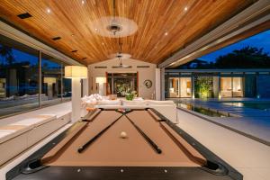a pool table in the middle of a house at Villa Essenza in Ban Han Pa To +21 photos