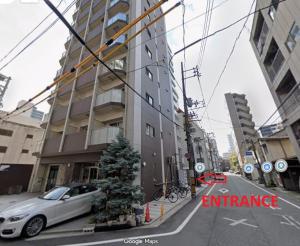 a car parked in front of a building with a christmas tree at Lion Heiwa Odori in Hiroshima