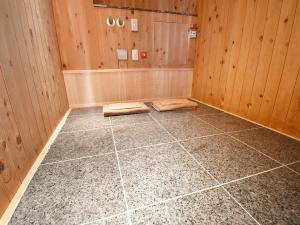 a room with a sauna with wooden walls and a tile floor at ホテル ヴォーグ in Kuwana +26 photos