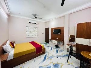 a bedroom with a bed with a fish rug on the floor at Villa D Amour in Pondicherry
