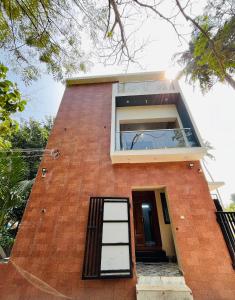 a brick house with a window and a door at Villa D Amour in Pondicherry