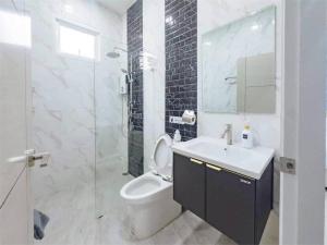 a bathroom with a toilet and a sink and a shower at Chern Mar Pool Villa Cha-am in Cha Am +18 photos