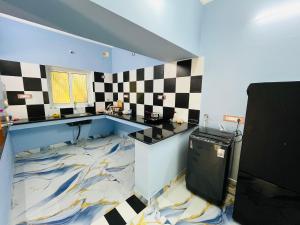 a bathroom with a sink and a counter with a marble floor at Villa D Amour in Pondicherry