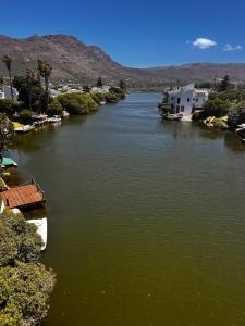 a river with two boats in the middle at Marina Dreams Studio Apartment in Marina Da Gama