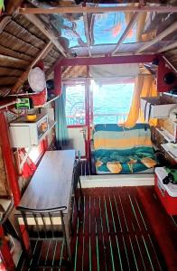 an inside view of an rv with a table and a couch at Warram mobile in Puerto Princesa City