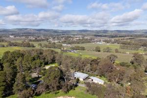 an aerial view of a farm with trees and houses at McLaren Flat Studio in McLaren Flat