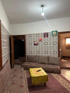 a living room with a couch and a table at Villa ben lahbib in Khenifra