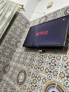 a laptop computer sitting on top of a table at Villa ben lahbib in Khenifra