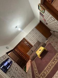 an overhead view of a room with carpets and floors at Villa ben lahbib in Khenifra