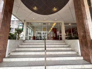 a group of stairs in front of a building at Hatyai Golden Crown Hotel in Hat Yai