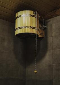 aendant light hanging from a ceiling with a chain at Gnishik Eco Lodge in Gnishik +49 photos