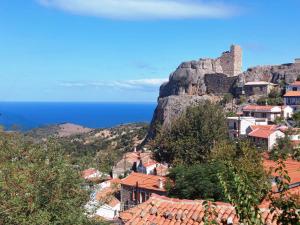 a view of a town with a castle on a mountain at Anna's Horizon in Samothraki +12 photos