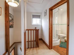 a bathroom with a toilet and a window at White Gates in Norwich +39 photos