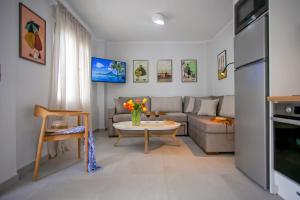 a living room with a couch and a table at Casa Govino - Dolce fare niente in Danilia
