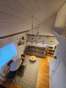 an overhead view of a living room with a table and chairs at Fisher Loft 30 in Kristiansund +10 photos