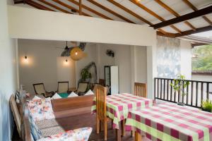 a dining room with a table and chairs at Surf Range in Matara +40 photos