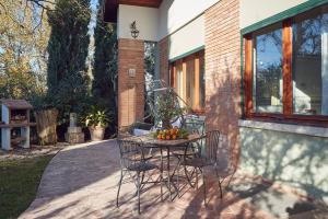 a table with chairs and fruit on a patio at Le Balze Appartamenti in Perugia