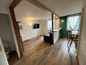 a living room with a sink and a desk at Le coeur du Velay 2 personnes in Le Puy-en-Velay
