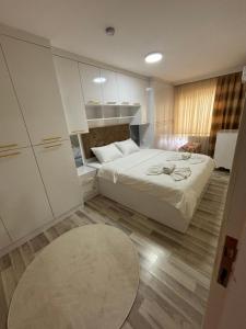 a small bedroom with a bed and a rug at Çilek Home in Pamukkale +51 photos
