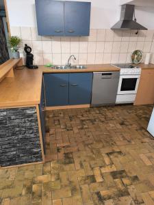 a kitchen with a sink and a counter top at Ferienwohnung Viktoria in Ehrlich