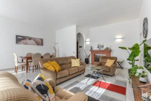 a living room with two couches and a table at A Casa di Nonna Anna in Porto Azzurro