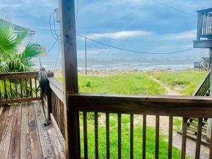 a deck with a view of the ocean from a house at Bailey Beach House Beach Views in Freeport