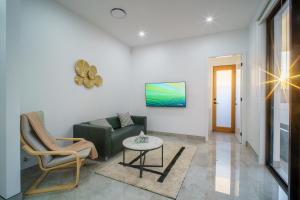 a living room with a couch and a table at Brand New Elegant House in Marsden Park