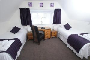 A bed or beds in a room at The Justin James Hotel 