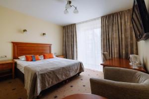 a hotel room with a bed and a window at Hestia Hotel Draugi in Riga +46 photos