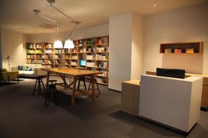 a dining room with a table and a library at Hotelaround Forest in Pyeongchang